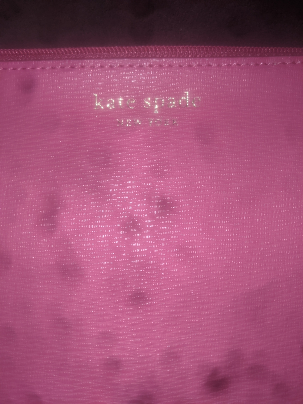 kate spade bright pink cosmetic pouch with gold logo